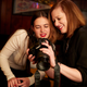 Donna and Ariel check out some shots.